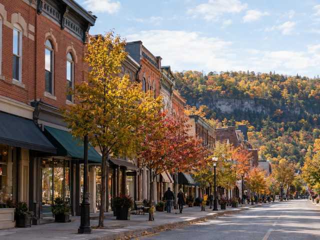 19th-century brick storefronts on Dundas's main street with the forested escarpment behind